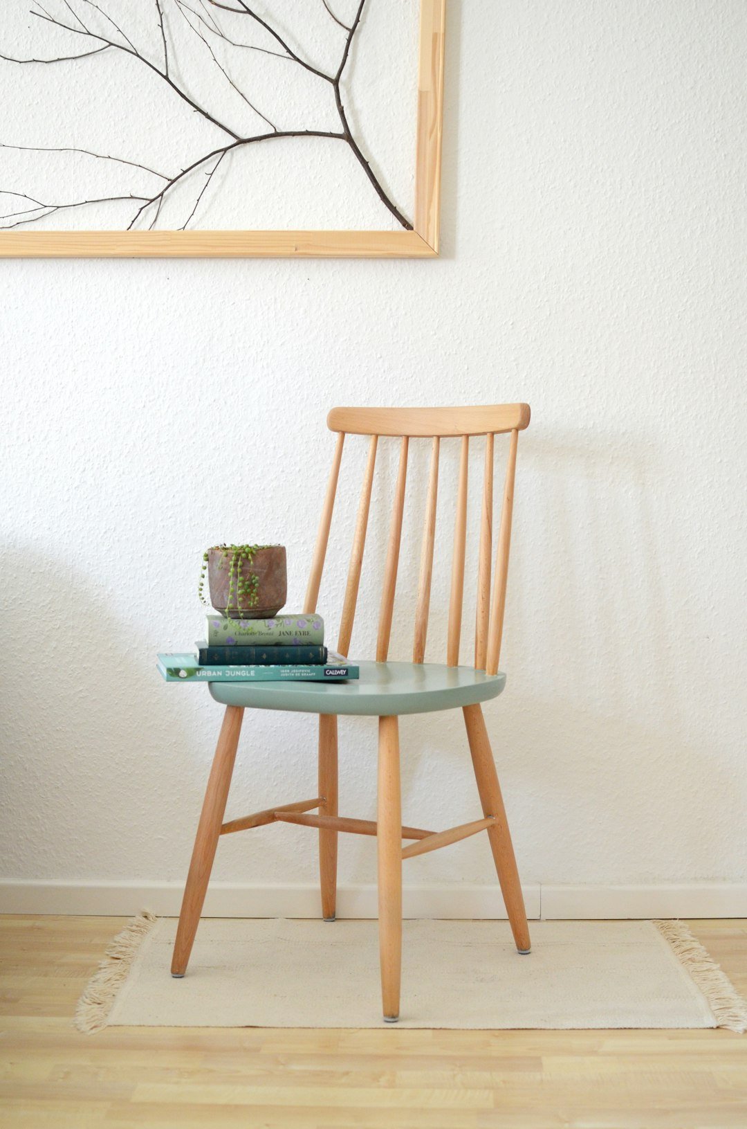 a-chair-with-books-on-it-buyxyk-bon4
